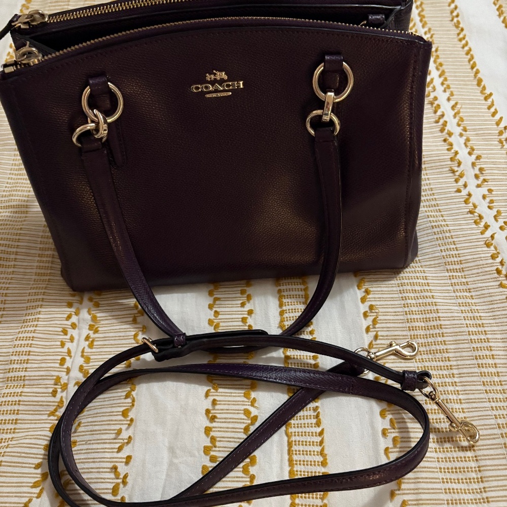 Purple Coach purse with extra strap